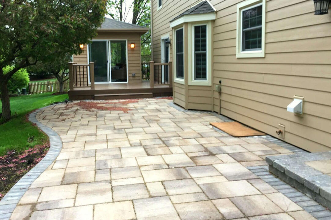 Delafield backyard paver patio example, featuring a contrasting border and a leveled design for sloped yards. A great option for expanding outdoor living space with durable materials.